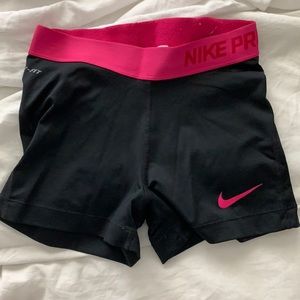 black and pink Nike Pros